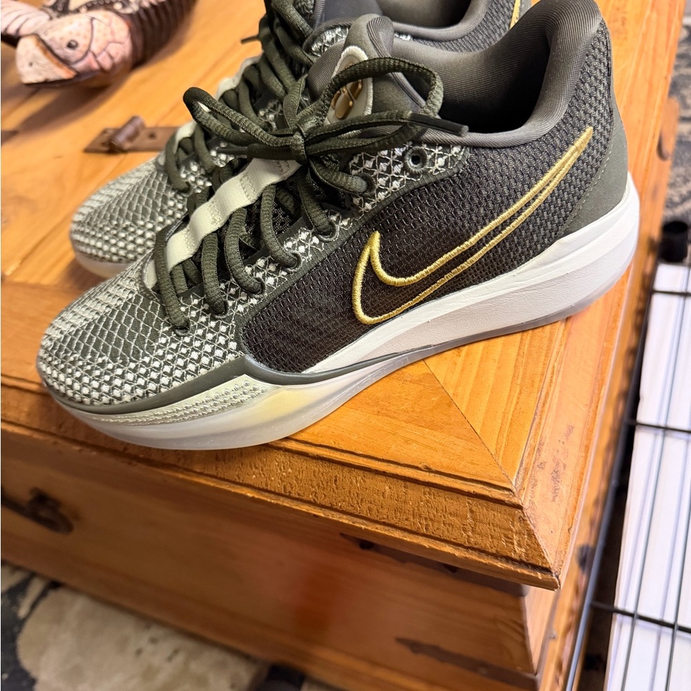 Nike green and gold basketball shoes